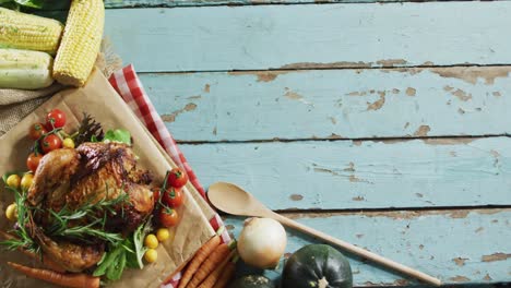 close up view of cooked chicken and multiple food ingredients with copy space on wooden surface