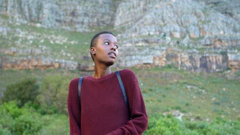 Woman-standing-with-arms-crossed-at-countryside-4k