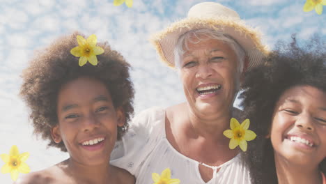 animación de flores sobre feliz anciana mujer afroamericana con nietos en una playa soleada