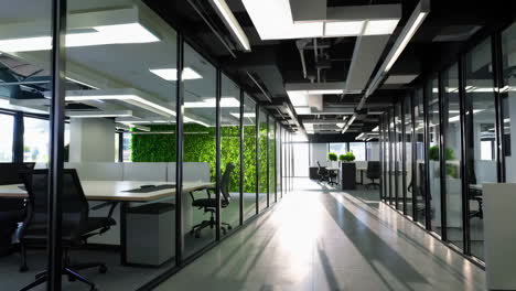 modern office interior with glass walls and greenery