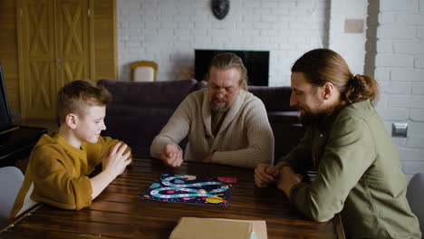 caucasian men and boy in the living room