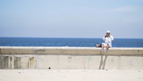 Man Playing Trumpet on Havana Beachfront