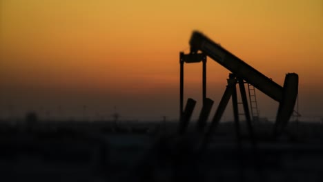 oil pump time lapse at sunset - defocused background