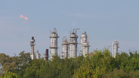 establishing shot of chemical refinery plant in pasadena, texas community