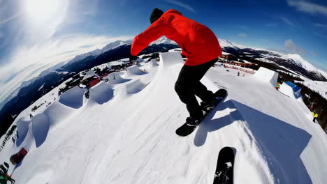snowboarder performing a trick in a ski park