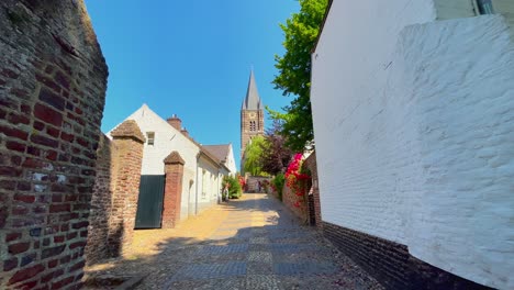 Beautiful-church-tower-in-Dutch-catholic-village-Thorn-during-spring