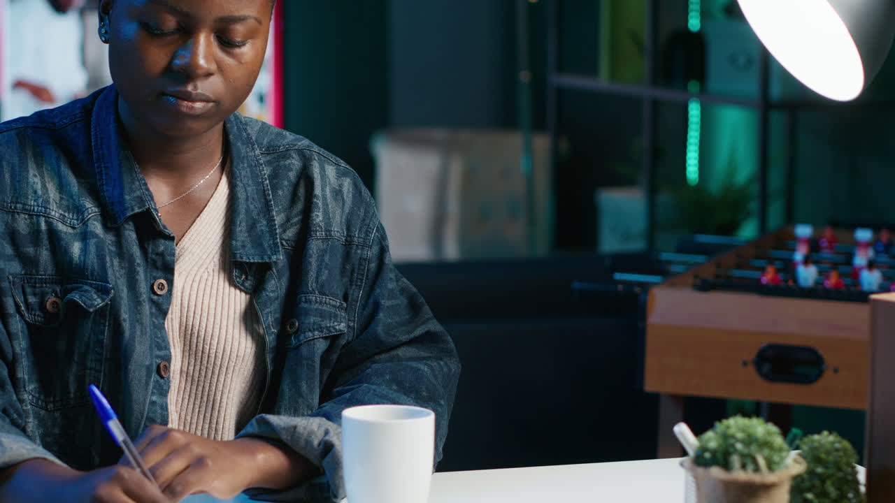 Woman working from home at night