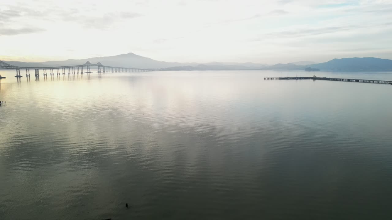 Panoramic aerial overview of Richmond Bridge from Point Molate Beach Richmond California USA, pullback