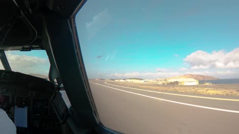 Inside-view-out-of-the-cockpit-of-a-aircraft-during-takeoff