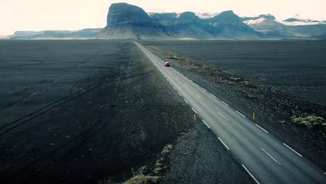 car driving through icelandic landscape