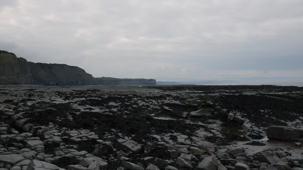 Stone beach in South of England, surrounded by cliffs