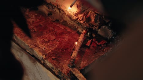 metal rod being welded with glowing sparks in detailed close up