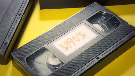 Picking-a-VHS-tape-with-a-label-on-it-and-putting-it-back