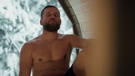 caucasian woman enjoying in the sauna in winter.