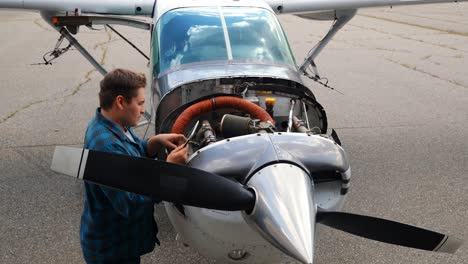 engineer using digital tablet while servicing aircraft engine 4k