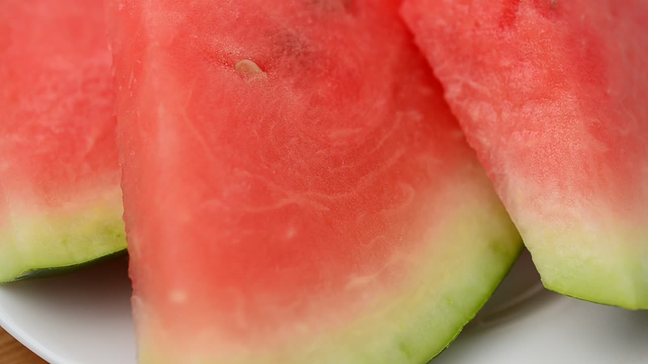 Shooting of a watermelon on turntable. Shooting in the movement