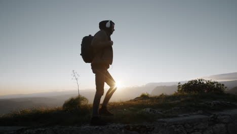 adventure man walks in the mountains