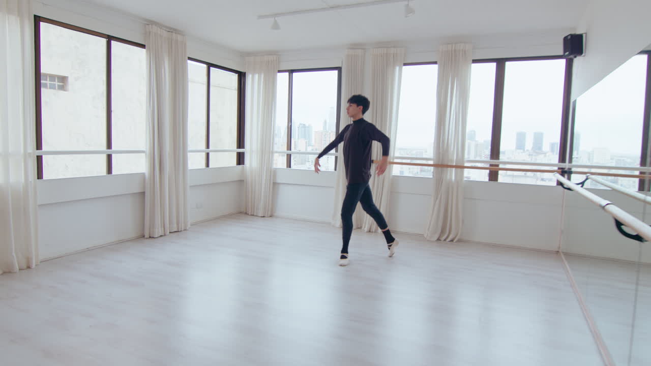 Talented Male Dancer Doing Ballet Pirouette at the Studio