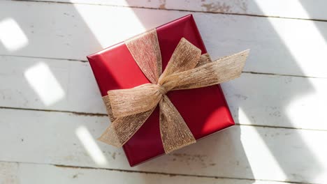 red gift box with gold ribbon