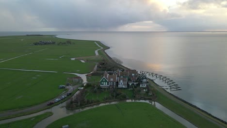 Settlement-in-Holland-on-coast-of-Marken-Island-during-sunrise,-Rozewerf