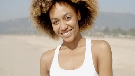 Female-Looking-And-Smiling-At-Camera