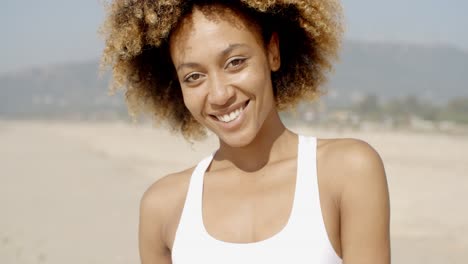 female looking and smiling at camera