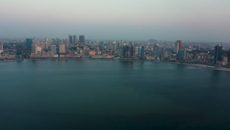 traveling right, luanda city, golden hour flying over luanda bay, africa
