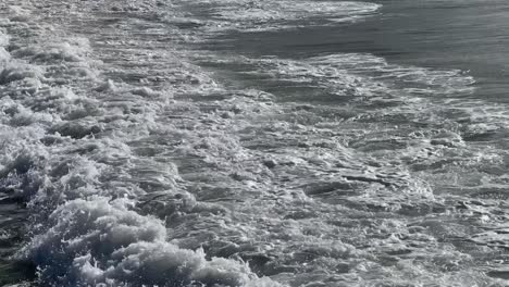 waves rolling into the beach