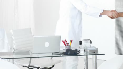 couple talking to a doctor in a medical office