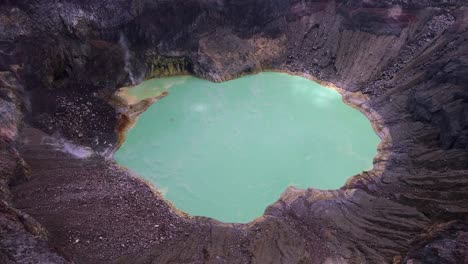 Steaming-hot-green-lake-bubbles-in-Santa-Ana-Volcano-crater,-aerial