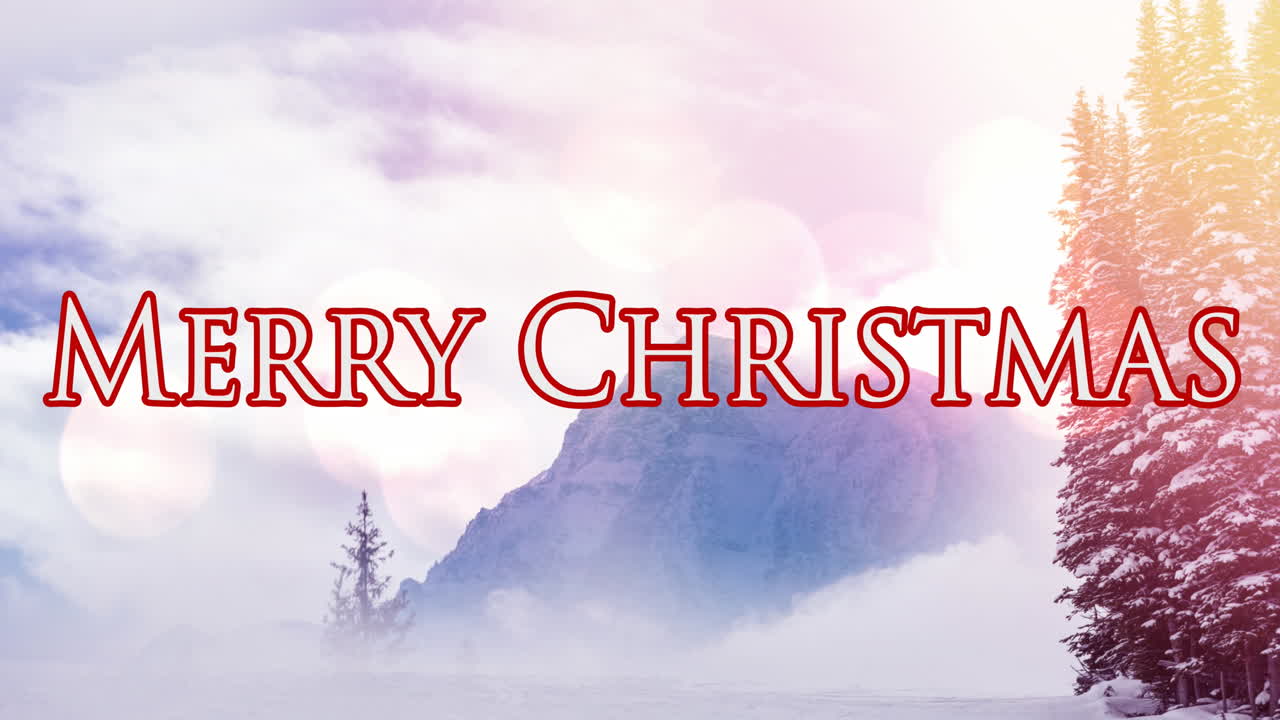 Animasjon av «God jul»-tekst over vinterlandskap