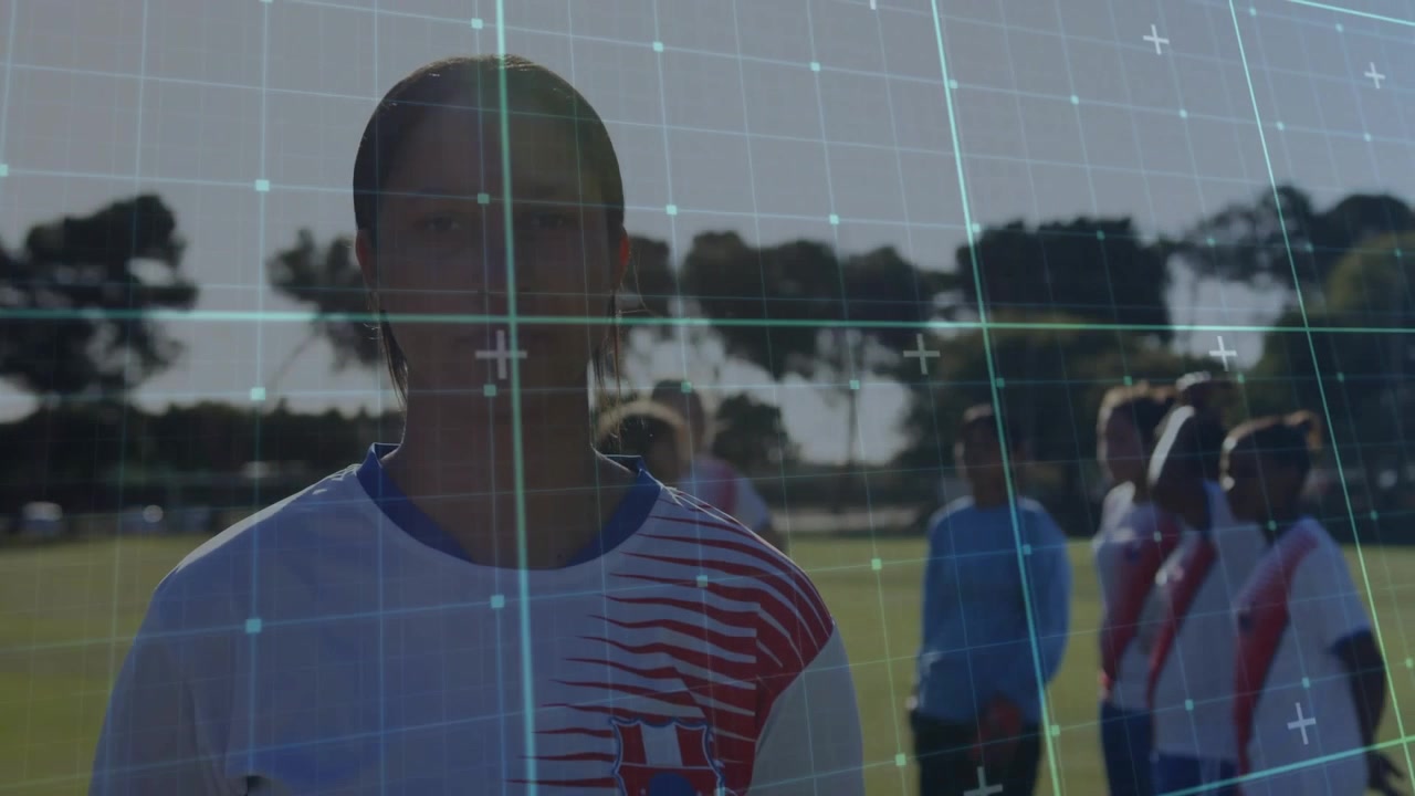 Female soccer player standing on pitch, grid appearing, scanning torso for sports analysis