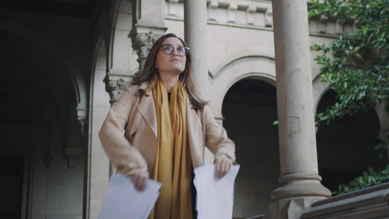 Student throwing documents in college