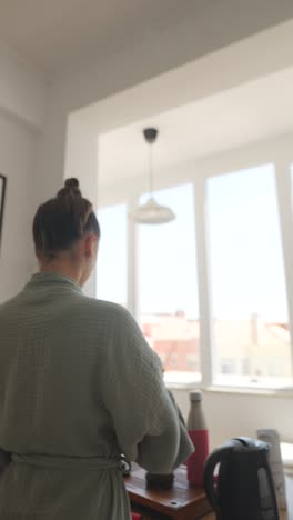 woman with incense stick in a relaxed home setting