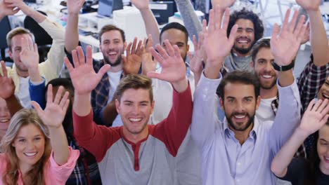 portrait of business team gesturing together in office