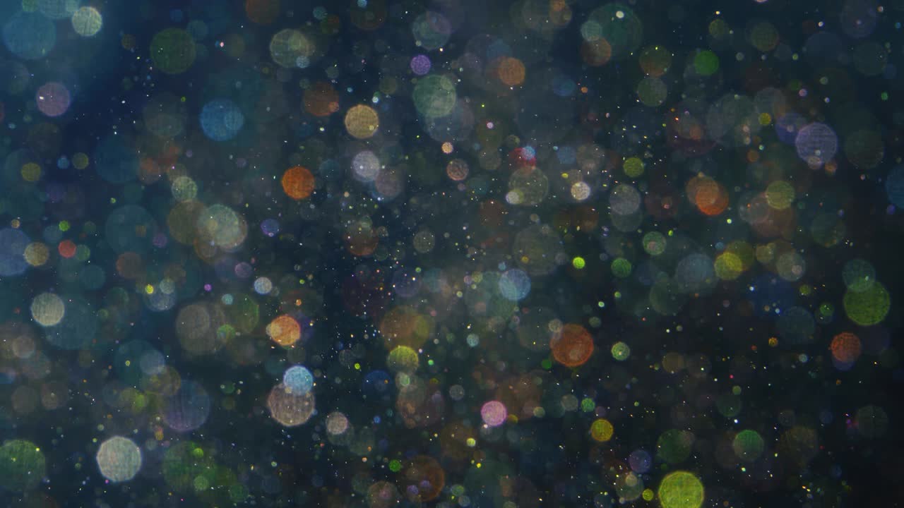 Abstract background with shining bokeh sparkles.