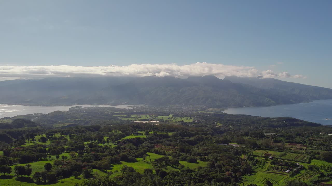 Slow Rising Aerial Drone Footage of Tahiti Island and Tahiti Iti from Mountain Top