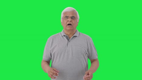 Sad-Indian-old-man-watching-something-shocking-Green-screen