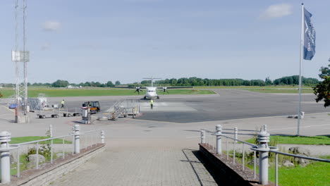 Airplane-air-craft-Boeing-approaching-airport-after-flight-across-countries-lifted-Covid-19-restrictions-free-travel-no-bans-commercial-jet-passenger-plane-landing-city-tourist-luggage-pilots-runway