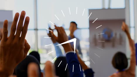 clock animation over diverse audience raising hands in conference setting