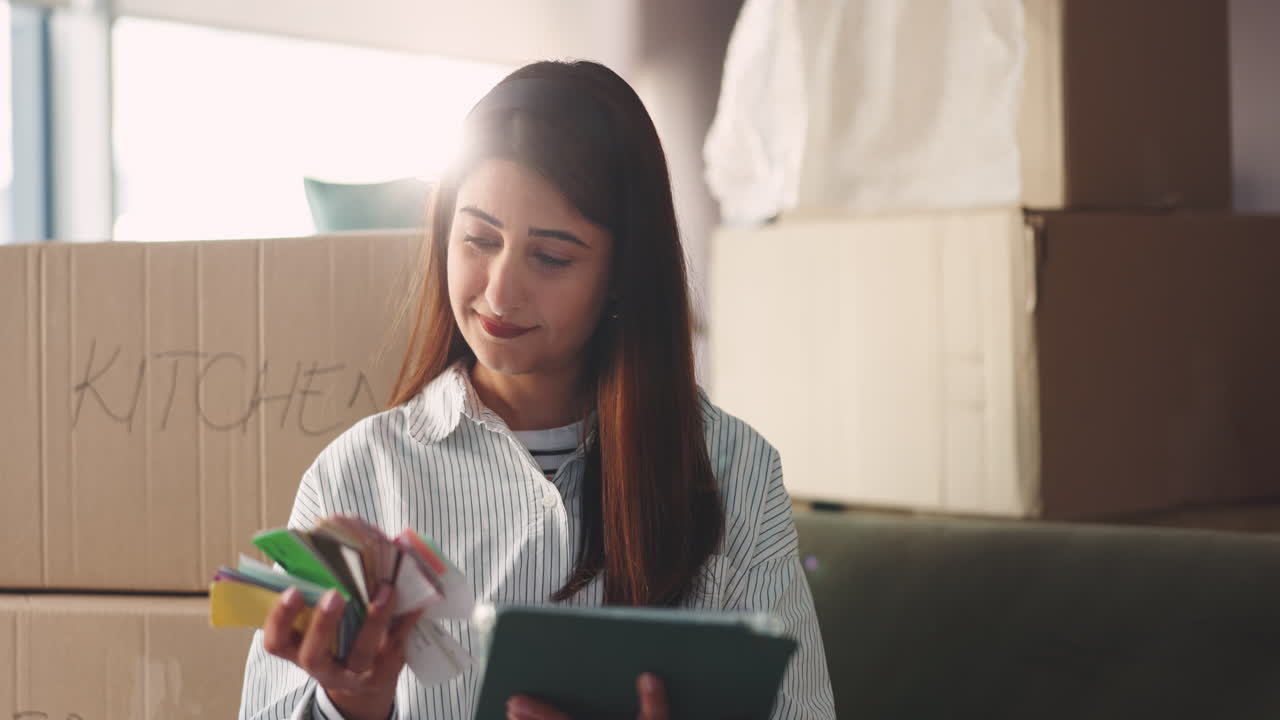 Woman moving with color swatches and boxes