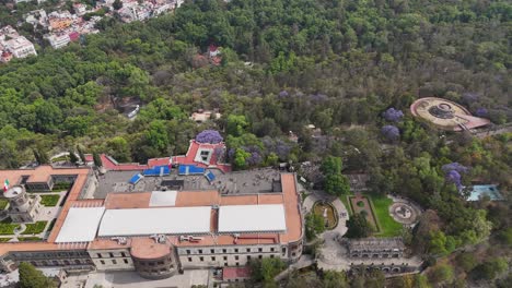 views of the historic chapultepec castle and urban park on a hilltop