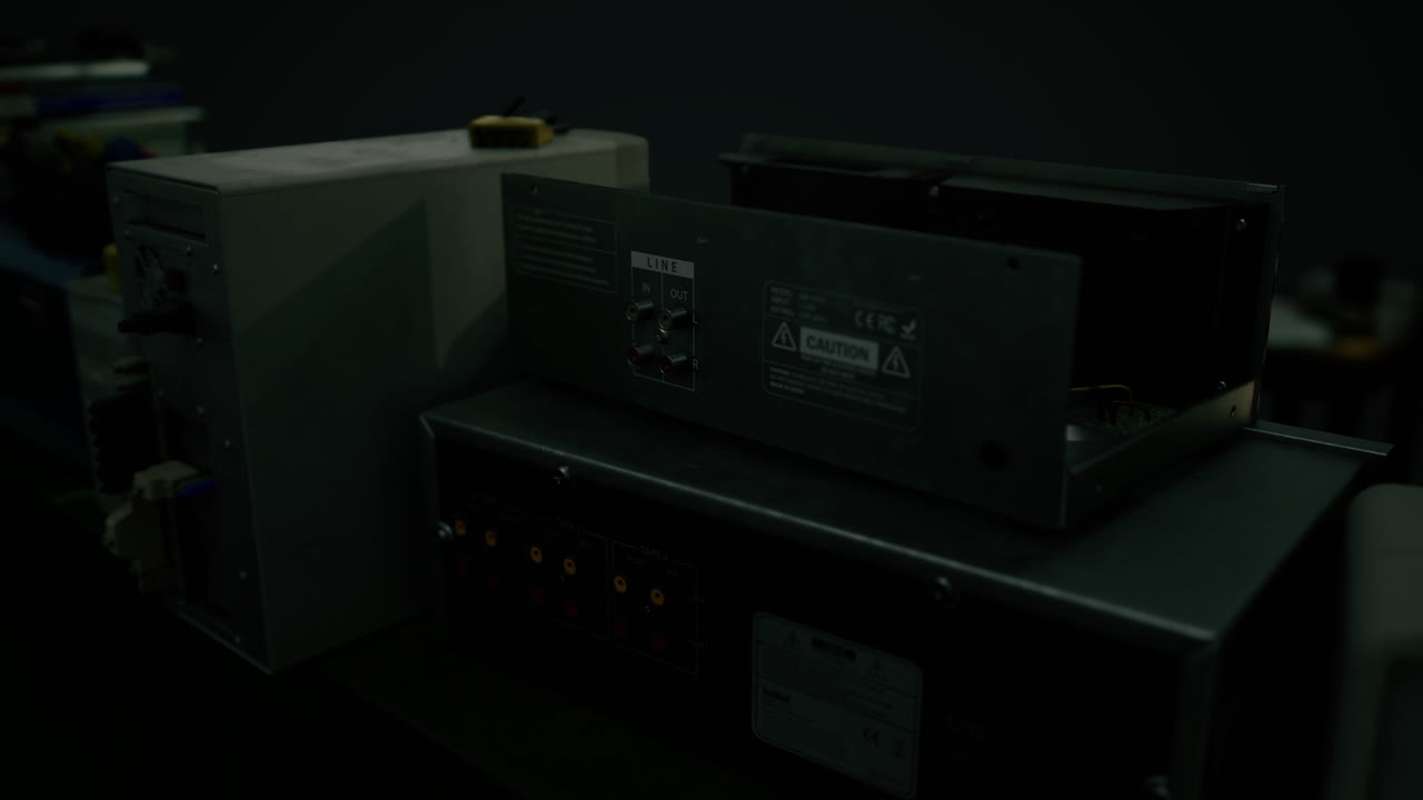 Industrial equipment on a workbench in a dimly lit workshop