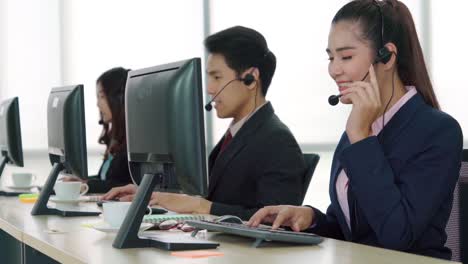 business people wearing headset working in office