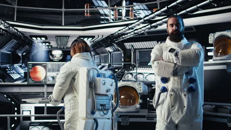 astronaut waves hand, communicating with command center to share discoveries