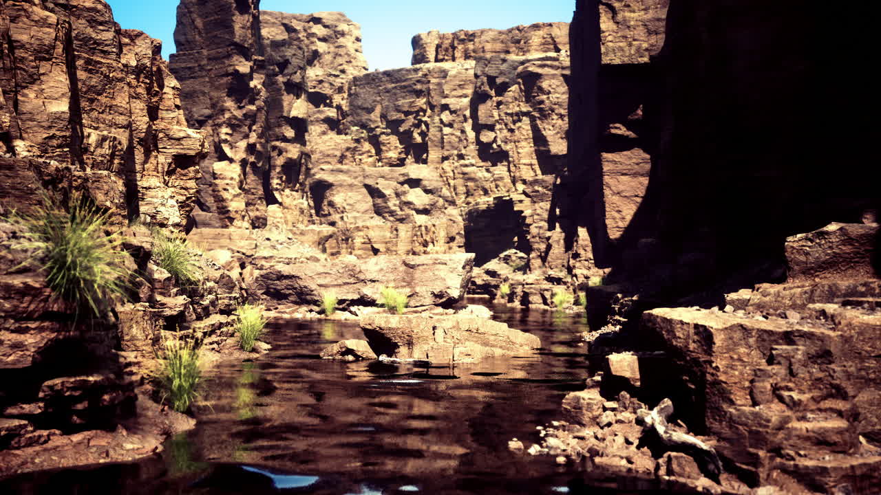 Serene canyon landscape with reflection in calm water during daylight