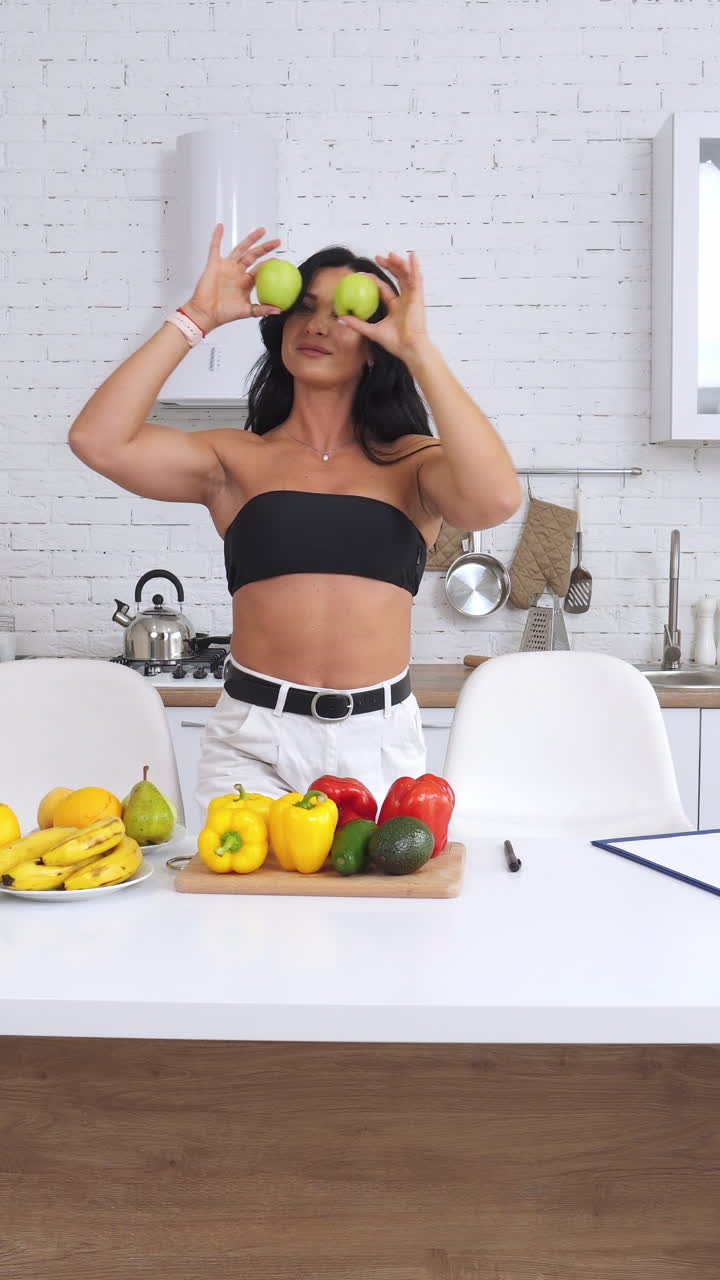 Fruits and vegetables products for vegetarian culinary. Healthy food prepairing in light kitchen. Vertical video