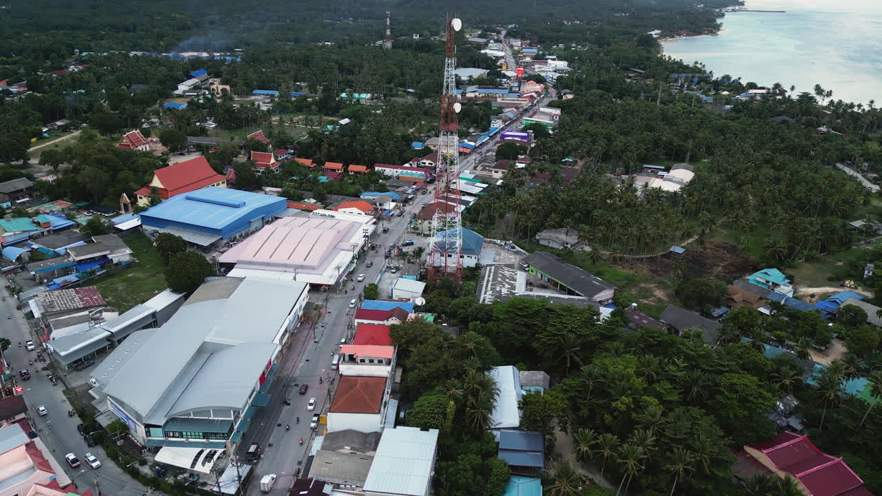 Pantip township with telecommunication tower in Koh Phangan island, aerial view