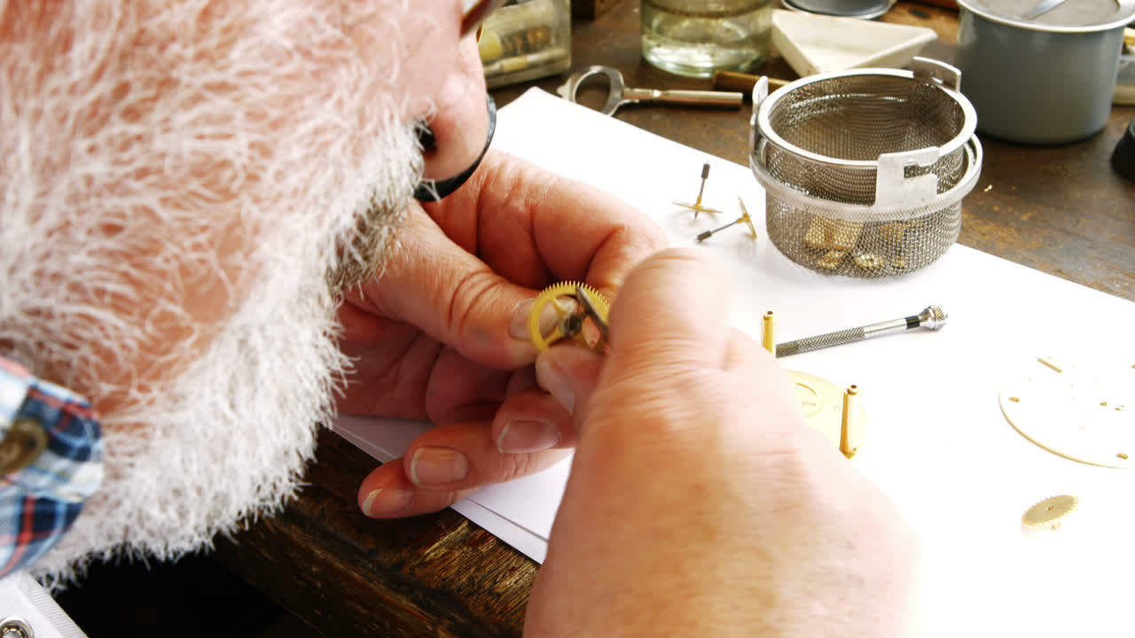 Horologist repairing a watch
