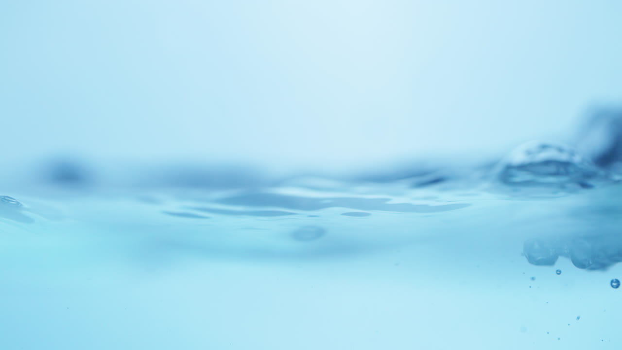 Intricate details of blue water waves, highlighting their refreshing qualities and purity in a stunning close-up shot.